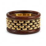Stack of chunky wooden bangle bracelets from SALVE, featuring natural wood tones and smooth, rounded designs for stylish wristwear.