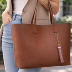 Salve Baddie mesh lipstick holder for handbags, black and pink design with mesh panel and compact size for easy carrying.