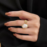 Salve Baroque faux pearl open adjustable ring featuring a stylish design with lustrous faux pearls on a sleek metal band.