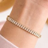 Salve Baguette Stone Tennis Bracelet featuring sparkling baguette-cut stones on a silver-tone bracelet design.