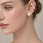 Round cut stainless steel stud earrings by SALVE featuring sleek, polished silver-tone earrings with a minimalist design.