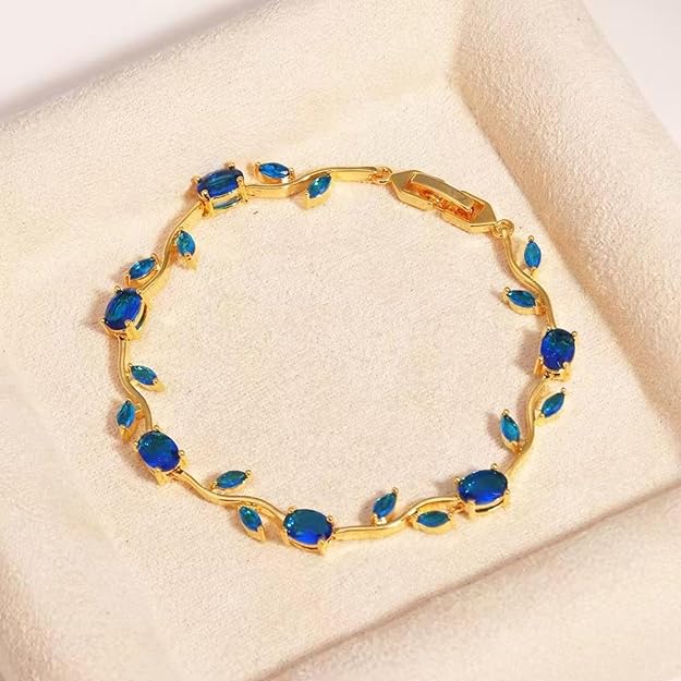 Blue tulip-shaped bracelet by SALVE featuring detailed floral design and vibrant blue color on a neutral background.