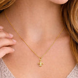 Salve Fleur de Lis pendant necklace featuring a detailed silver charm on a delicate chain.
