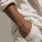 Salve Twin Fish Grey Bracelet for Men featuring two silver-tone fish charms on a sleek grey cord.