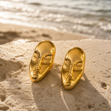 Gold statement face card stud earrings by SALVE featuring bold, artistic design for a stylish look.