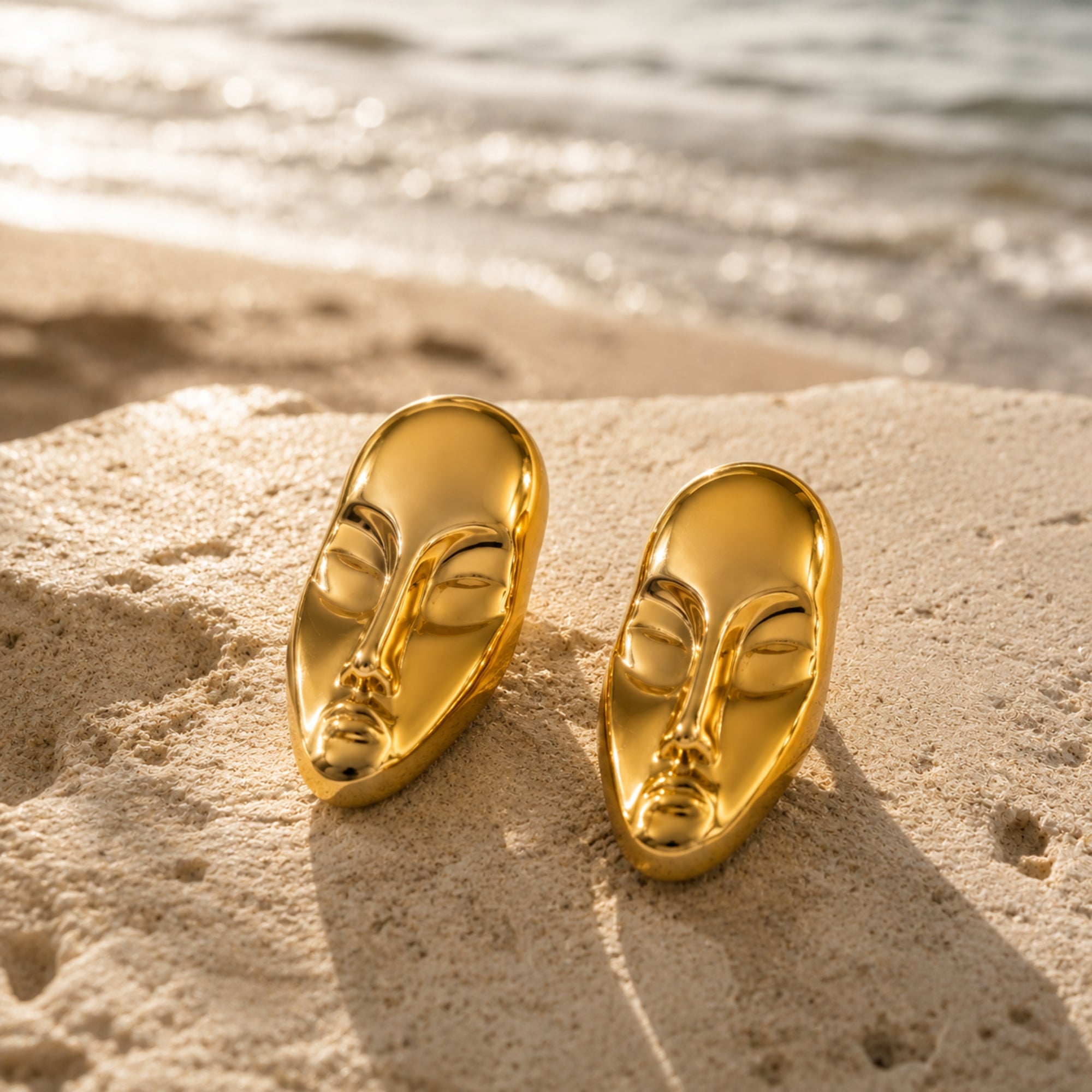 Gold statement face card stud earrings by SALVE featuring bold, artistic design for a stylish look.