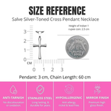 Silver-toned SALVE cross pendant necklace with detailed religious symbol, hanging from a delicate chain.
