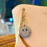 Salve Puffy Smiley Face Keychain with soft, plush design and bright yellow color, featuring a cheerful smiling face.