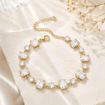 SALVE emerald cut and round stone bracelet with elegant design, featuring sparkling stones on a delicate metal band.