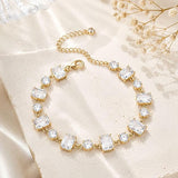 SALVE emerald cut and round stone bracelet with elegant design, featuring sparkling stones on a delicate metal band.
