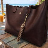 Salve Baddie mesh lipstick holder for handbags, compact and stylish with a black mesh design and secure zipper closure.