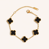 Elegant black Clover adjustable chain bracelet by SALVE featuring gold accents and intricate detailing.