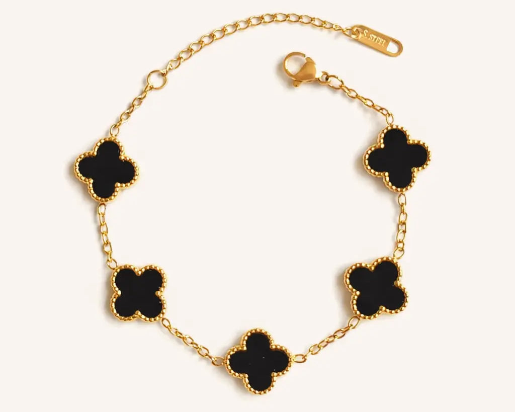 Elegant black Clover adjustable chain bracelet by SALVE featuring gold accents and intricate detailing.