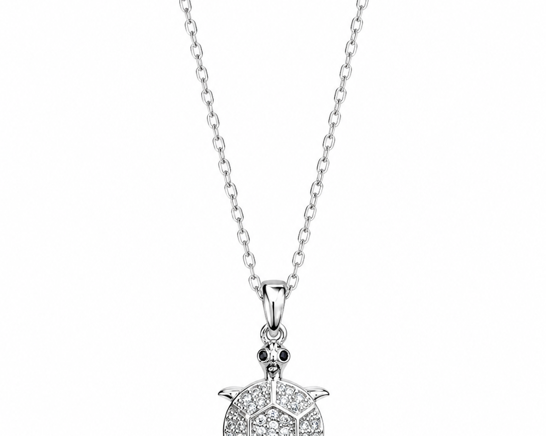 Stainless steel CZ turtle pendant necklace with detailed turtle design, crafted by SALVE, on a sleek chain.