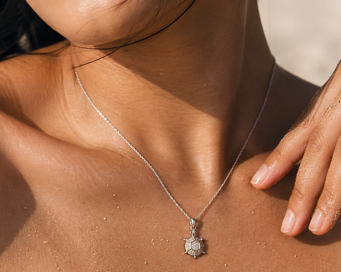Stainless steel CZ turtle pendant necklace by SALVE featuring a detailed turtle design on a sleek chain.