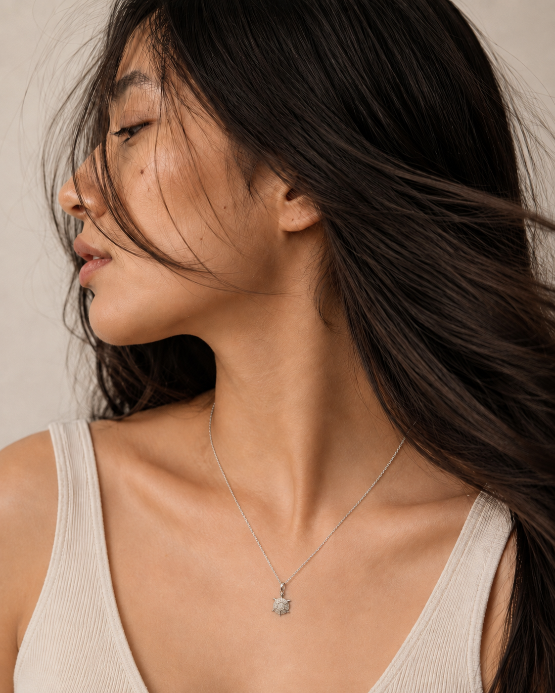 Stainless steel CZ turtle pendant necklace by SALVE featuring a detailed turtle design on a sleek chain.